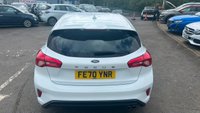 USED 2020 70 FORD FOCUS 1.5 EcoBlue ST-Line Hatchback 5dr Diesel Manual Euro 6 (s/s) (120 ps) in white with only 2 owners and a full service history in lovely condition. This 2020 Ford Focus ST Line offers a compelling blend of sporty styling and efficient diesel performance.  Powered by a 1.5 litre Euro 6 compliant diesel engine with a full service history with 5 service stamps, this ST Line variant is designed for those who appreciate a dynamic driving experience without compromising on economy.  Its registration year of 2020 places it within a modern generation of the Focus, known for its refined handling and comfortable interior.  The ST Line trim level sign