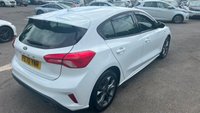 USED 2020 70 FORD FOCUS 1.5 EcoBlue ST-Line Hatchback 5dr Diesel Manual Euro 6 (s/s) (120 ps) in white with only 2 owners and a full service history in lovely condition. This 2020 Ford Focus ST Line offers a compelling blend of sporty styling and efficient diesel performance.  Powered by a 1.5 litre Euro 6 compliant diesel engine with a full service history with 5 service stamps, this ST Line variant is designed for those who appreciate a dynamic driving experience without compromising on economy.  Its registration year of 2020 places it within a modern generation of the Focus, known for its refined handling and comfortable interior.  The ST Line trim level sign