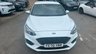 USED 2020 70 FORD FOCUS 1.5 EcoBlue ST-Line Hatchback 5dr Diesel Manual Euro 6 (s/s) (120 ps) in white with only 2 owners and a full service history in lovely condition. This 2020 Ford Focus ST Line offers a compelling blend of sporty styling and efficient diesel performance.  Powered by a 1.5 litre Euro 6 compliant diesel engine with a full service history with 5 service stamps, this ST Line variant is designed for those who appreciate a dynamic driving experience without compromising on economy.  Its registration year of 2020 places it within a modern generation of the Focus, known for its refined handling and comfortable interior.  The ST Line trim level sign