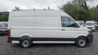 USED 2021 21 VOLKSWAGEN CRAFTER Trendline MWB High Roof CR35 Tdi 102 PS With Air Conditioning, Electric Windows, Parking Sensors, Criose control, Internal racking, Roof Rack and Side Loading door in great condition. 1 Owner from new - 4 Service stamps in the book . This is a genuine commercial opportunity to acquire a highly specified 21 plate Volkswagen Crafter Trendline in medium wheelbase, high roof configuration. Finished in a professional commercial colour, this van presents in great condition throughout and offers an exceptional specification list that is rarely found in a single vehicle at this price point.  The factory-fitted Trendline trim elevates this Crafter well beyond a standard workhorse. Air conditioning ensures cabin comfort during long shifts or warm weather, while electric windows and cruise control make motorway miles effortless and relaxed. The inclusion of front and rear parking sensors takes the stress out of tight urban manoeuvres, protecting both your vehicle and those around you.  This particular van has been carefully specified for immediate productive use. It benefits from professionally installed internal racking, providing secure and organised storage for tools, equipment, or stock. A robust roof rack adds further load-carrying flexibility, while the side loading door offers excellent accessibility for urban deliveries or site work where rear access is restricted. The combination of these features means this Crafter is ready to earn its keep from day one.  Under the bonnet lies the proven 2.0-litre TDI engine producing 102 PS, delivering dependable and efficient performance suited to both city driving and longer hauls. The CR35 designation confirms a gross vehicle weight of 3.5 tonnes, keeping this van within standard car licence requirements while offering a substantial payload capacity.  The service history is a standout feature of this offering. Supplied new to just one owner from new, the vehicle has been meticulously maintained with four service stamps recorded in the service book. This consistent maintenance schedule provides genuine peace of mind and demonstrates the care this van has received throughout its life. The condition reflects this careful ownership, with the bodywork, cab interior, and load area all presenting very well for a working vehicle.  This Crafter represents an intelligent purchase for any sole trader, fleet operator, or business looking to expand or upgrade their commercial fleet. The high specification, factory options, and documented service history make this a van that stands apart from the average used commercial vehicle. It requires no immediate preparation and is ready to be driven away and put straight to work. Viewing is highly recommended to appreciate the condition and specification on offer. For further details, including a full walk-around video and service record verification, please contact the sales team directly. Competitive finance packages and part-exchange options are available. Do not delay, as a van of this calibre in this condition will not remain available for long. 
