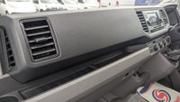 USED 2021 21 VOLKSWAGEN CRAFTER Trendline MWB High Roof CR35 Tdi 102 PS With Air Conditioning, Electric Windows, Parking Sensors, Criose control, Internal racking, Roof Rack and Side Loading door in great condition. 1 Owner from new - 4 Service stamps in the book . This is a genuine commercial opportunity to acquire a highly specified 21 plate Volkswagen Crafter Trendline in medium wheelbase, high roof configuration. Finished in a professional commercial colour, this van presents in great condition throughout and offers an exceptional specification list that is rarely found in a single vehicle at this price point.  The factory-fitted Trendline trim elevates this Crafter well beyond a standard workhorse. Air conditioning ensures cabin comfort during long shifts or warm weather, while electric windows and cruise control make motorway miles effortless and relaxed. The inclusion of front and rear parking sensors takes the stress out of tight urban manoeuvres, protecting both your vehicle and those around you.  This particular van has been carefully specified for immediate productive use. It benefits from professionally installed internal racking, providing secure and organised storage for tools, equipment, or stock. A robust roof rack adds further load-carrying flexibility, while the side loading door offers excellent accessibility for urban deliveries or site work where rear access is restricted. The combination of these features means this Crafter is ready to earn its keep from day one.  Under the bonnet lies the proven 2.0-litre TDI engine producing 102 PS, delivering dependable and efficient performance suited to both city driving and longer hauls. The CR35 designation confirms a gross vehicle weight of 3.5 tonnes, keeping this van within standard car licence requirements while offering a substantial payload capacity.  The service history is a standout feature of this offering. Supplied new to just one owner from new, the vehicle has been meticulously maintained with four service stamps recorded in the service book. This consistent maintenance schedule provides genuine peace of mind and demonstrates the care this van has received throughout its life. The condition reflects this careful ownership, with the bodywork, cab interior, and load area all presenting very well for a working vehicle.  This Crafter represents an intelligent purchase for any sole trader, fleet operator, or business looking to expand or upgrade their commercial fleet. The high specification, factory options, and documented service history make this a van that stands apart from the average used commercial vehicle. It requires no immediate preparation and is ready to be driven away and put straight to work. Viewing is highly recommended to appreciate the condition and specification on offer. For further details, including a full walk-around video and service record verification, please contact the sales team directly. Competitive finance packages and part-exchange options are available. Do not delay, as a van of this calibre in this condition will not remain available for long. 