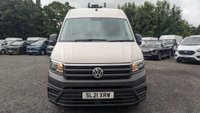 USED 2021 21 VOLKSWAGEN CRAFTER Trendline MWB High Roof CR35 Tdi 102 PS With Air Conditioning, Electric Windows, Parking Sensors, Criose control, Internal racking, Roof Rack and Side Loading door in great condition. 1 Owner from new - 4 Service stamps in the book . This is a genuine commercial opportunity to acquire a highly specified 21 plate Volkswagen Crafter Trendline in medium wheelbase, high roof configuration. Finished in a professional commercial colour, this van presents in great condition throughout and offers an exceptional specification list that is rarely found in a single vehicle at this price point.  The factory-fitted Trendline trim elevates this Crafter well beyond a standard workhorse. Air conditioning ensures cabin comfort during long shifts or warm weather, while electric windows and cruise control make motorway miles effortless and relaxed. The inclusion of front and rear parking sensors takes the stress out of tight urban manoeuvres, protecting both your vehicle and those around you.  This particular van has been carefully specified for immediate productive use. It benefits from professionally installed internal racking, providing secure and organised storage for tools, equipment, or stock. A robust roof rack adds further load-carrying flexibility, while the side loading door offers excellent accessibility for urban deliveries or site work where rear access is restricted. The combination of these features means this Crafter is ready to earn its keep from day one.  Under the bonnet lies the proven 2.0-litre TDI engine producing 102 PS, delivering dependable and efficient performance suited to both city driving and longer hauls. The CR35 designation confirms a gross vehicle weight of 3.5 tonnes, keeping this van within standard car licence requirements while offering a substantial payload capacity.  The service history is a standout feature of this offering. Supplied new to just one owner from new, the vehicle has been meticulously maintained with four service stamps recorded in the service book. This consistent maintenance schedule provides genuine peace of mind and demonstrates the care this van has received throughout its life. The condition reflects this careful ownership, with the bodywork, cab interior, and load area all presenting very well for a working vehicle.  This Crafter represents an intelligent purchase for any sole trader, fleet operator, or business looking to expand or upgrade their commercial fleet. The high specification, factory options, and documented service history make this a van that stands apart from the average used commercial vehicle. It requires no immediate preparation and is ready to be driven away and put straight to work. Viewing is highly recommended to appreciate the condition and specification on offer. For further details, including a full walk-around video and service record verification, please contact the sales team directly. Competitive finance packages and part-exchange options are available. Do not delay, as a van of this calibre in this condition will not remain available for long. 