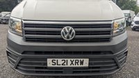 USED 2021 21 VOLKSWAGEN CRAFTER Trendline MWB High Roof CR35 Tdi 102 PS With Air Conditioning, Electric Windows, Parking Sensors, Criose control, Internal racking, Roof Rack and Side Loading door in great condition. 1 Owner from new - 4 Service stamps in the book . This is a genuine commercial opportunity to acquire a highly specified 21 plate Volkswagen Crafter Trendline in medium wheelbase, high roof configuration. Finished in a professional commercial colour, this van presents in great condition throughout and offers an exceptional specification list that is rarely found in a single vehicle at this price point.  The factory-fitted Trendline trim elevates this Crafter well beyond a standard workhorse. Air conditioning ensures cabin comfort during long shifts or warm weather, while electric windows and cruise control make motorway miles effortless and relaxed. The inclusion of front and rear parking sensors takes the stress out of tight urban manoeuvres, protecting both your vehicle and those around you.  This particular van has been carefully specified for immediate productive use. It benefits from professionally installed internal racking, providing secure and organised storage for tools, equipment, or stock. A robust roof rack adds further load-carrying flexibility, while the side loading door offers excellent accessibility for urban deliveries or site work where rear access is restricted. The combination of these features means this Crafter is ready to earn its keep from day one.  Under the bonnet lies the proven 2.0-litre TDI engine producing 102 PS, delivering dependable and efficient performance suited to both city driving and longer hauls. The CR35 designation confirms a gross vehicle weight of 3.5 tonnes, keeping this van within standard car licence requirements while offering a substantial payload capacity.  The service history is a standout feature of this offering. Supplied new to just one owner from new, the vehicle has been meticulously maintained with four service stamps recorded in the service book. This consistent maintenance schedule provides genuine peace of mind and demonstrates the care this van has received throughout its life. The condition reflects this careful ownership, with the bodywork, cab interior, and load area all presenting very well for a working vehicle.  This Crafter represents an intelligent purchase for any sole trader, fleet operator, or business looking to expand or upgrade their commercial fleet. The high specification, factory options, and documented service history make this a van that stands apart from the average used commercial vehicle. It requires no immediate preparation and is ready to be driven away and put straight to work. Viewing is highly recommended to appreciate the condition and specification on offer. For further details, including a full walk-around video and service record verification, please contact the sales team directly. Competitive finance packages and part-exchange options are available. Do not delay, as a van of this calibre in this condition will not remain available for long. 