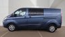 USED 2021 21 FORD TRANSIT CUSTOM Blue 2.0 320 EcoBlue Limited Crew Van, 29,801 miles, 6 Seats, Euro 6, Air Conditioning, Heated seats, Alloys, F&R sensors. Plus VAT @ 20%! This 2021 Ford Transit Custom 320 Limited van stands out with its exceptionally low mileage of just 29,801 miles, a rare find for a vehicle of its age, and has been owned by only one person. It features a robust 2.0L Diesel Engine, meets Euro 6 emission standards, and offers comfortable seating for six occupants. The van comes with a 3 month warranty for your peace of mind, and its MOT is valid until March 2027, ensuring its roadworthiness.  The Limited trim level enhances the driving experience