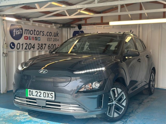 View our Hyundai Kona 39kWh SE Connect SUV 5dr Electric Auto (10.5kW Charger) (136 ps)+2 KEYS+1 OWNER FROM NEW+FSH+PARK CONTROL+HEATED SEATS+2 CABLES+AIRCON+BLUETOOTH+MEDIA+NAV+ALLOYS+CLIMATE+CRUISE