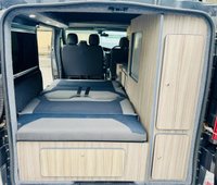 USED 2014 14 RENAULT TRAFIC 2.0 dCi SL27 Sport Panel Van 3dr Diesel Manual L1 H1 (198 g/km, 115 bhp) Here we have a lovely low mileage affordable example of a 4 berth professionally converted campervan, finished in metallic black. We converted this van around 2 years ago and last owner has slept in it less tan half a dozen times. Kiravan tested double front swivel, so giving it 5 belted traveling seats, Smev sink and hob, Victron charging system, Rear Bike rack. interion was fully retrimmed in a stunning factory looking grey and blue colours. C AND H Pop top fitted.