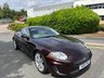 USED 2010 10 JAGUAR XK 5.0 V8 Portfolio Coupe 2dr Petrol Auto Euro 5 (385 ps)-Superb Low Mileage Example-Finished In Rare Caviar Metallic-Heated Ivory Leather Upholstery.11 Services On File.The Very Best. 