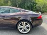 USED 2010 10 JAGUAR XK 5.0 V8 Portfolio Coupe 2dr Petrol Auto Euro 5 (385 ps)-Superb Low Mileage Example-Finished In Rare Caviar Metallic-Heated Ivory Leather Upholstery.11 Services On File.The Very Best. 