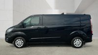 USED 2021 71 FORD TRANSIT CUSTOM Black 2.0 300 EcoBlue Limited L2 van, 26,700 miles, Rear seats & windows Conversion, Euro 6, 6-Speed manual, A/C, alloys, F&R sensors. Plus VAT @ 20%! This 2021 Ford Transit Custom 300 Limited has been maintained by only one owner and has covered just 26,700 miles. This 2.0 litre diesel van is a Limited trim model, featuring the Euro 6 emission standard and an MOT valid until October 2026. Inside, the cabin is equipped with front manual air conditioning and the ICE Feature Pack 21, which includes Bluetooth connectivity for your devices. The vehicle also comes with the Visibility Pack High, providing automatic headlights with a follow me home f