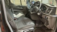 USED 2021 71 FORD TRANSIT CUSTOM Black 2.0 300 EcoBlue Limited L2 van, 26,700 miles, Rear seats & windows Conversion, Euro 6, 6-Speed manual, A/C, alloys, F&R sensors. Plus VAT @ 20%! This 2021 Ford Transit Custom 300 Limited has been maintained by only one owner and has covered just 26,700 miles. This 2.0 litre diesel van is a Limited trim model, featuring the Euro 6 emission standard and an MOT valid until October 2026. Inside, the cabin is equipped with front manual air conditioning and the ICE Feature Pack 21, which includes Bluetooth connectivity for your devices. The vehicle also comes with the Visibility Pack High, providing automatic headlights with a follow me home f
