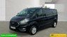 USED 2021 71 FORD TRANSIT CUSTOM Black 2.0 300 EcoBlue Limited L2 van, 26,700 miles, Rear seats & windows Conversion, Euro 6, 6-Speed manual, A/C, alloys, F&R sensors. Plus VAT @ 20%! This 2021 Ford Transit Custom 300 Limited has been maintained by only one owner and has covered just 26,700 miles. This 2.0 litre diesel van is a Limited trim model, featuring the Euro 6 emission standard and an MOT valid until October 2026. Inside, the cabin is equipped with front manual air conditioning and the ICE Feature Pack 21, which includes Bluetooth connectivity for your devices. The vehicle also comes with the Visibility Pack High, providing automatic headlights with a follow me home f