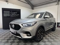 USED 2023 23 MG MG ZS 1.0 T-GDI Exclusive SUV 5dr Petrol Auto Euro 6 (111 ps) Top-spec MG ZS Exclusive finished in Silver with automatic transmission, panoramic sky roof, heated leather-style seats, satellite navigation, Apple CarPlay & Android Auto, reversing camera, rear parking sensors, keyless entry, and alloy wheels. A spacious, economical SUV that&rsquo;s perfect for family life or everyday driving.
