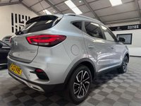 USED 2023 23 MG MG ZS 1.0 T-GDI Exclusive SUV 5dr Petrol Auto Euro 6 (111 ps) Top-spec MG ZS Exclusive finished in Silver with automatic transmission, panoramic sky roof, heated leather-style seats, satellite navigation, Apple CarPlay & Android Auto, reversing camera, rear parking sensors, keyless entry, and alloy wheels. A spacious, economical SUV that&rsquo;s perfect for family life or everyday driving.
