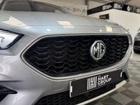 USED 2023 23 MG MG ZS 1.0 T-GDI Exclusive SUV 5dr Petrol Auto Euro 6 (111 ps) Top-spec MG ZS Exclusive finished in Silver with automatic transmission, panoramic sky roof, heated leather-style seats, satellite navigation, Apple CarPlay & Android Auto, reversing camera, rear parking sensors, keyless entry, and alloy wheels. A spacious, economical SUV that&rsquo;s perfect for family life or everyday driving.