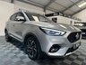 USED 2023 23 MG MG ZS 1.0 T-GDI Exclusive SUV 5dr Petrol Auto Euro 6 (111 ps) Top-spec MG ZS Exclusive finished in Silver with automatic transmission, panoramic sky roof, heated leather-style seats, satellite navigation, Apple CarPlay & Android Auto, reversing camera, rear parking sensors, keyless entry, and alloy wheels. A spacious, economical SUV that&rsquo;s perfect for family life or everyday driving.