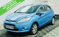 USED 2009 58 FORD FIESTA 1.25 Zetec Hatchback 5dr Petrol Manual (133 g/km, 81 bhp) Clean and well-presented Ford Fiesta 1.25 Zetec finished in Electric Blue Metallic. Reliable and economical 1.25 petrol engine &ndash; not to be confused with the later 1.0 EcoBoost. Great first car with 15" alloy wheels, air conditioning, QuickClear heated windscreen, AUX, electric windows and heated mirrors. Supplied with a full service, new 12-month MOT, 3-month warranty and the option to upgrade to an 18-month nationwide Gold Cover warranty for just &pound;199.
