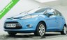 USED 2009 58 FORD FIESTA 1.25 Zetec Hatchback 5dr Petrol Manual (133 g/km, 81 bhp) Clean and well-presented Ford Fiesta 1.25 Zetec finished in Electric Blue Metallic. Reliable and economical 1.25 petrol engine &ndash; not to be confused with the later 1.0 EcoBoost. Great first car with 15" alloy wheels, air conditioning, QuickClear heated windscreen, AUX, electric windows and heated mirrors. Supplied with a full service, new 12-month MOT, 3-month warranty and the option to upgrade to an 18-month nationwide Gold Cover warranty for just &pound;199.