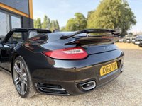 USED 2012 62 PORSCHE 911 3.8 997 Turbo Cabriolet 2dr Petrol PDK AWD (268 g/km, 500 bhp) PORSCHE 911 3.8 997 TURBO S CABRIOLET + PDK 7 SPEED AUTOMATIC + GREAT SPECIFICATION + HEATED ELECTRIC BLACK LEATHER SPORTS SEATS + ADJUSTABLE SPOILER + HEADLIGHT WASHERS + ADAPTIVE SPORTS SUSPENSION + LOW MILES + RADIO & CD PLAYER + BLUETOOTH TELEPHONE + CIGARETTE LIGHTER + ELECTRICALLY OPERATED SOFT TOP CONVERTIBLE ROOF + SATNAV + CUPHOLDERS + MUCH MORE...   12 MONTHS MOT + 6 MONTHS WARRANTY + PART EXCHANGE WELCOME + NATIONWIDE DELIVERY AVAILABLE