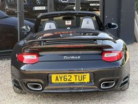 USED 2012 62 PORSCHE 911 3.8 997 Turbo Cabriolet 2dr Petrol PDK AWD (268 g/km, 500 bhp) PORSCHE 911 3.8 997 TURBO S CABRIOLET + PDK 7 SPEED AUTOMATIC + GREAT SPECIFICATION + HEATED ELECTRIC BLACK LEATHER SPORTS SEATS + ADJUSTABLE SPOILER + HEADLIGHT WASHERS + ADAPTIVE SPORTS SUSPENSION + LOW MILES + RADIO & CD PLAYER + BLUETOOTH TELEPHONE + CIGARETTE LIGHTER + ELECTRICALLY OPERATED SOFT TOP CONVERTIBLE ROOF + SATNAV + CUPHOLDERS + MUCH MORE...   12 MONTHS MOT + 6 MONTHS WARRANTY + PART EXCHANGE WELCOME + NATIONWIDE DELIVERY AVAILABLE