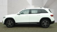 USED 2023 23 MERCEDES-BENZ EQB White EQB 300 AMG Line, 29,650 miles, Electric 4MATIC, 7 seats, Sat nav, Rear camera, Heated front seats, Part leather, ULEZ compliant. This 2023 Mercedes-Benz EQB 300 AMG Line is a well-maintained vehicle that has had only one owner from new. As an all-electric SUV with four-wheel drive, this AMG Line model offers a practical solution for families, featuring seven seats and a spacious boot. The vehicle is equipped with a 73 kWh battery that provides a range of 253 miles when new, and it comes with an MOT valid until June 2027. Comfort and safety are prioritised through features such as heated front seats, THERMOTRONIC automatic