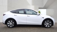 USED 2023 23 TESLA MODEL Y White Dual Motor Long Range SUV, 66,808 miles, Electric 4WD, Leather, Heated seats, Glass roof, Sat nav, Rear camera, Climate control. This 2023 Tesla Model Y Long Range has been kept in excellent condition by its only owner and comes with an MOT valid until March 2027. As an all-electric vehicle with a four-wheel drive system, this model is designed for efficiency and capability. Inside, the cabin is equipped with dual zone climate control and a heated steering wheel for comfort, while passengers in the back benefit from heated seats. The interior experience is enhanced by an expansive glass roof that offers ultraviolet and in
