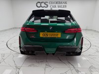 USED 2025 25 BMW M5 4.4 22.1kWh Touring 5dr Petrol Plug-in Hybrid Steptronic xDrive Euro 6 (s/s) (727 ps) Finished In Metalic Isle Of Man Green, This M5 Comes With The Driving Assistant Pro Package, Glass Panoramic Roof, Comfort Package, 20 & 21" M Light Alloy Wheels,  With Sport Tyres, Anthracite Alacantra Headlining, Towbar, M Carbon Side Mirror Caps, Adaptive LED Headlights, BMW Iconic Glow Exterior Pack, M Multifunction Seat, M Multifunction Seat, Front And Rear Heated Seats,CT Front Splitter Carbon Rear Diffuser, Parking Assistance System Plus, Bowers And Wilkins Surround Sound System.