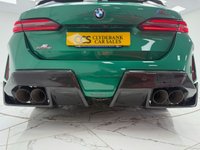 USED 2025 25 BMW M5 4.4 22.1kWh Touring 5dr Petrol Plug-in Hybrid Steptronic xDrive Euro 6 (s/s) (727 ps) Finished In Metalic Isle Of Man Green, This M5 Comes With The Driving Assistant Pro Package, Glass Panoramic Roof, Comfort Package, 20 & 21" M Light Alloy Wheels,  With Sport Tyres, Anthracite Alacantra Headlining, Towbar, M Carbon Side Mirror Caps, Adaptive LED Headlights, BMW Iconic Glow Exterior Pack, M Multifunction Seat, M Multifunction Seat, Front And Rear Heated Seats,CT Front Splitter Carbon Rear Diffuser, Parking Assistance System Plus, Bowers And Wilkins Surround Sound System.