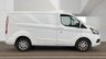 USED 2021 FORD TRANSIT CUSTOM L1 H1 Limited Tdci 130 PS SWB With Air Conditioning, Factory Fitted Sat Nav- Electric Pack, Heated Screen, Parking sensors, Internal Racking in great condition . 1 Owner from new - 2 Keys - 5 Main Dealer Service stamps in the book . This Ford Custom L1 H1 Limited in the short wheelbase configuration is now available for sale. Powered by the reliable 130 PS TDCi diesel engine, this van has had just one owner from new and comes complete with two keys and a fully stamped main dealer service book containing five services.  The specification is exceptionally high. Air conditioning is fitted as standard, alongside a factory-fitted satellite navigation system. The Electric Pack provides convenience at the touch of a button, while the heated front screen ensures clear visibility during cold mornings. Front and rear parking sensors make manoeuvring in tight spaces straightforward and stress-free.  Inside the load area, the van benefits from internal racking that is in great condition, offering practical storage solutions for tools and equipment without the need for aftermarket installation. The bodywork and interior are both presented to a very high standard, reflecting the care taken by its sole previous owner. 
