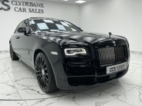 USED 2017 53 ROLLS-ROYCE GHOST 6.6 V12 Saloon 4dr Petrol Auto Euro 6 (563 bhp) Finished In Black, This Rolls Royce Ghost Comes With A Panorama Sunroof, Full Service History, Rear Seat Entertainment With Dual Spirirt Of Ecstasy Rotary Controller, Steering Wheel In Dark Spice, Active Air Suspension, Dynamic LED Headlights, Heads Up Display, 22" Hawk Alloy Wheels With Floating RR Emblem, Reverse And 360 Degree Cameras, Dark Chrome Spirit Of Ecstasy, 4 Zone Climate Control, Front And Rear Heated And Memory Seats, Two Tone Leather In Consort Red/Black.
