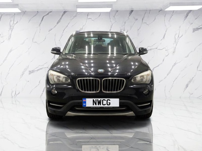 2013 BMW X1 in black — photo 3 of 11
