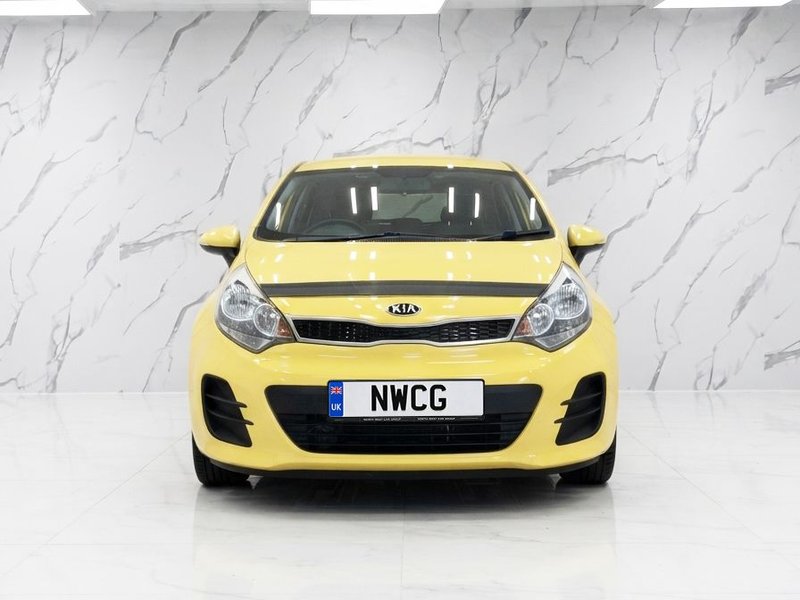 2015 Kia Rio in yellow — photo 2 of 12