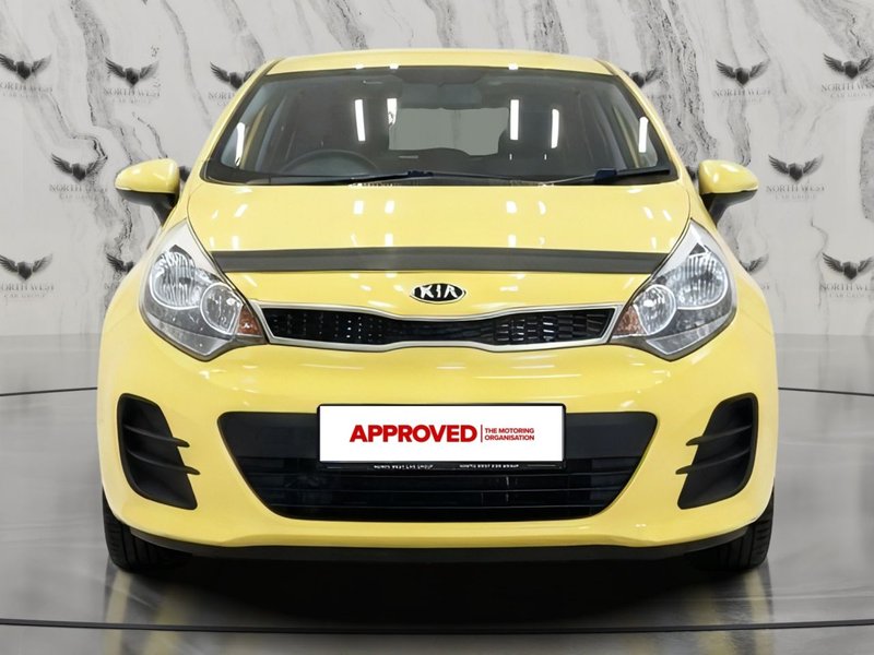 2015 Kia Rio in yellow — photo 2 of 16
