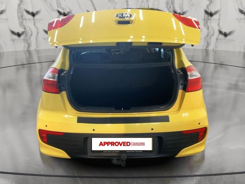 2015 Kia Rio in yellow — photo 10 of 16